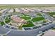 Aerial view of community with clubhouse, park, and parking lot at 86 E Iloca Ln, Queen Creek, AZ 85140