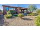 Landscaped backyard with gravel, artificial turf, and desert plants at 86 E Iloca Ln, Queen Creek, AZ 85140