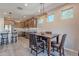 Bright dining area with wooden table and access to backyard at 86 E Iloca Ln, Queen Creek, AZ 85140