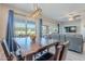 Dining area with wooden table and view of living room at 86 E Iloca Ln, Queen Creek, AZ 85140