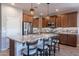 Island kitchen with granite countertops and stainless steel appliances at 86 E Iloca Ln, Queen Creek, AZ 85140