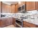 Kitchen features stainless steel appliances and granite countertops at 86 E Iloca Ln, Queen Creek, AZ 85140