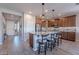 Modern kitchen with granite countertops, wooden cabinets, and stainless steel appliances at 86 E Iloca Ln, Queen Creek, AZ 85140