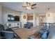 Spacious living room featuring comfortable seating and a large TV at 86 E Iloca Ln, Queen Creek, AZ 85140