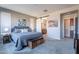 Main bedroom with sliding barn door to bathroom at 86 E Iloca Ln, Queen Creek, AZ 85140