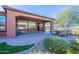 Relaxing patio with seating area, fire pit, and built-in grill at 86 E Iloca Ln, Queen Creek, AZ 85140