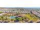 Aerial view of community pool, clubhouse, and surrounding landscape at 8700 E University Dr # 3505, Mesa, AZ 85207