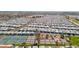 Aerial view of community tennis courts and many homes at 8700 E University Dr # 3505, Mesa, AZ 85207