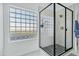 Modern bathroom with a large shower and marble finishes at 8740 W Bloomfield Rd, Peoria, AZ 85381