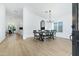 Bright dining room with a farmhouse table and black chairs at 8740 W Bloomfield Rd, Peoria, AZ 85381