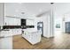 Modern kitchen with white cabinets, marble countertops, and stainless steel appliances at 8740 W Bloomfield Rd, Peoria, AZ 85381