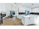 Modern kitchen with white cabinets, a large island and stainless steel appliances at 8740 W Bloomfield Rd, Peoria, AZ 85381