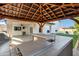 Outdoor kitchen with grill, sink, and wood pergola at 8740 W Bloomfield Rd, Peoria, AZ 85381