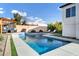 Modern rectangular pool with waterfall feature and pergola at 8740 W Bloomfield Rd, Peoria, AZ 85381