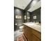 Elegant bathroom with wood vanity, tile flooring, and a toilet at 9580 E Southwind Ln, Scottsdale, AZ 85262