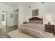 Spacious bedroom with a king-size bed and wood nightstand at 9580 E Southwind Ln, Scottsdale, AZ 85262