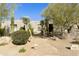 Desert landscaping surrounds this single-story home with a three-car garage at 9580 E Southwind Ln, Scottsdale, AZ 85262