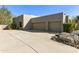 Three-car garage with large concrete driveway at 9580 E Southwind Ln, Scottsdale, AZ 85262