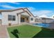 Home with a refreshing pool and grassy backyard at 10053 E Seismic Ave, Mesa, AZ 85212