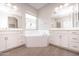 Spa-like bathroom with soaking tub and double vanity at 10053 E Seismic Ave, Mesa, AZ 85212