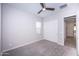 Bedroom with ceiling fan, carpet, and sliding closet doors at 10053 E Seismic Ave, Mesa, AZ 85212