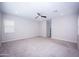 Bright and airy bedroom featuring neutral walls and carpet at 10053 E Seismic Ave, Mesa, AZ 85212