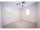 Bedroom with ceiling fan, window blinds and carpet flooring at 10053 E Seismic Ave, Mesa, AZ 85212