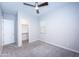 Bedroom with walk-in closet and ceiling fan at 10053 E Seismic Ave, Mesa, AZ 85212