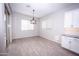 Bright breakfast nook with light wood floors and window views at 10053 E Seismic Ave, Mesa, AZ 85212