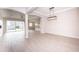 Open concept dining room with light wood floors and modern chandelier at 10053 E Seismic Ave, Mesa, AZ 85212