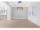 Bright dining room featuring hardwood floors and a stylish chandelier at 10053 E Seismic Ave, Mesa, AZ 85212