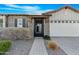 Craftsman style home with brick and siding exterior, gated entry, and two-car garage at 10053 E Seismic Ave, Mesa, AZ 85212