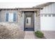 Brick front entry with a black metal gate and pathway at 10053 E Seismic Ave, Mesa, AZ 85212