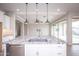 Modern kitchen island with granite countertops and stainless steel sink at 10053 E Seismic Ave, Mesa, AZ 85212