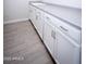 Laundry room with white cabinets and gray countertop at 10053 E Seismic Ave, Mesa, AZ 85212