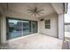 Covered patio with sliding glass doors and ceiling fan at 10053 E Seismic Ave, Mesa, AZ 85212