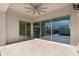 Covered patio with sliding glass doors and ceiling fan at 10053 E Seismic Ave, Mesa, AZ 85212