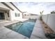 Inviting swimming pool with gray coping and landscaping at 10053 E Seismic Ave, Mesa, AZ 85212