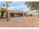 Landscaped backyard with gravel and desert landscaping at 10828 E Flintlock Dr, Sun Lakes, AZ 85248