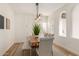 Modern farmhouse dining room with light walls and wooden table at 10828 E Flintlock Dr, Sun Lakes, AZ 85248