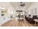 Bright living room with fireplace and sliding door access to the backyard at 10828 E Flintlock Dr, Sun Lakes, AZ 85248