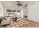 Living room with vaulted ceiling, fireplace and large windows at 10828 E Flintlock Dr, Sun Lakes, AZ 85248