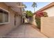 Landscaped side yard with pergola and flowering plants at 10828 E Flintlock Dr, Sun Lakes, AZ 85248