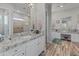 Elegant bathroom with dual vanities, granite countertops, and a walk-in shower at 11842 W Creosote Dr, Peoria, AZ 85383