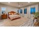 Serene bedroom with wood furniture, large windows, and a cozy atmosphere at 11842 W Creosote Dr, Peoria, AZ 85383