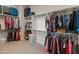 Large walk-in closet with ample hanging and shelving space at 11842 W Creosote Dr, Peoria, AZ 85383