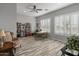 Bright home office with a desk, comfy chair, and natural light at 11842 W Creosote Dr, Peoria, AZ 85383