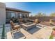 Relaxing patio with fire pit and comfortable seating at 11842 W Creosote Dr, Peoria, AZ 85383