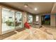 Covered patio with sliding glass doors opening to the living room at 11842 W Creosote Dr, Peoria, AZ 85383