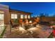 Relaxing patio with a fire pit and comfortable seating at 11842 W Creosote Dr, Peoria, AZ 85383